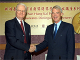 Prof. Sir James A. Mirrlees (left) and Prof. A. Michael Spence (right)